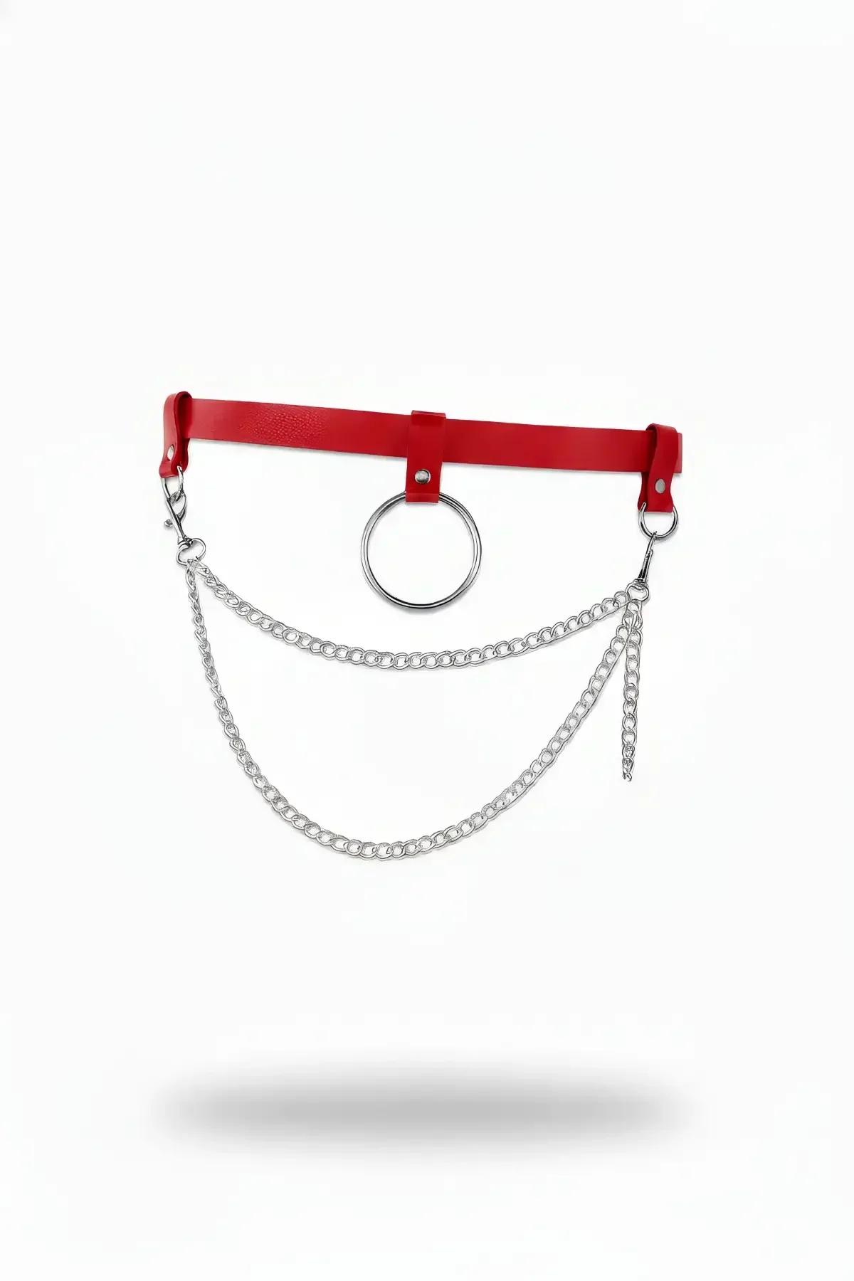 red faux leather O-ring waist belt with dual draped silver curb chains on white background