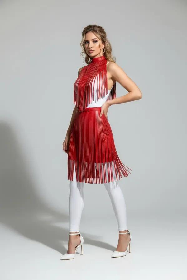 red faux leather high-waist fringe overlay skirt two-tier cascading strips worn over white leggings