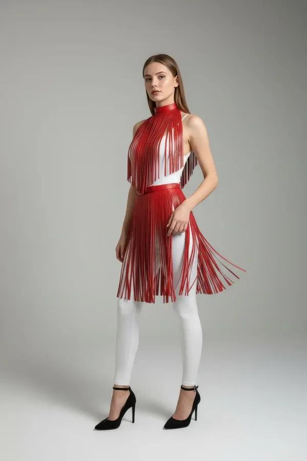red faux leather high-waist fringe overlay skirt two-tier cascading strips worn over white leggings
