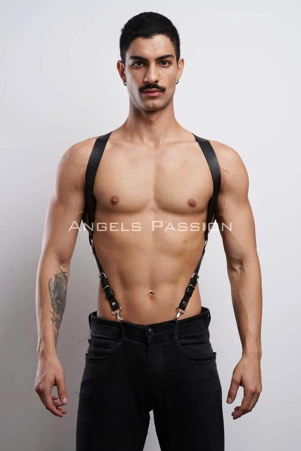 Black faux leather shoulder harness men suspender style silver metal clips worn over bare torso