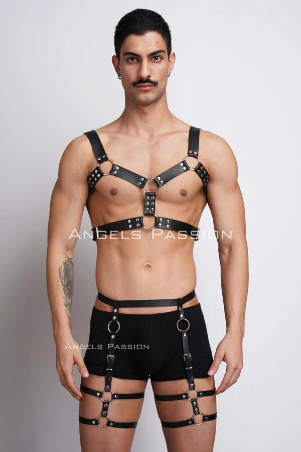 black faux leather full body harness with silver O-ring accents on chest and leg straps worn by male model