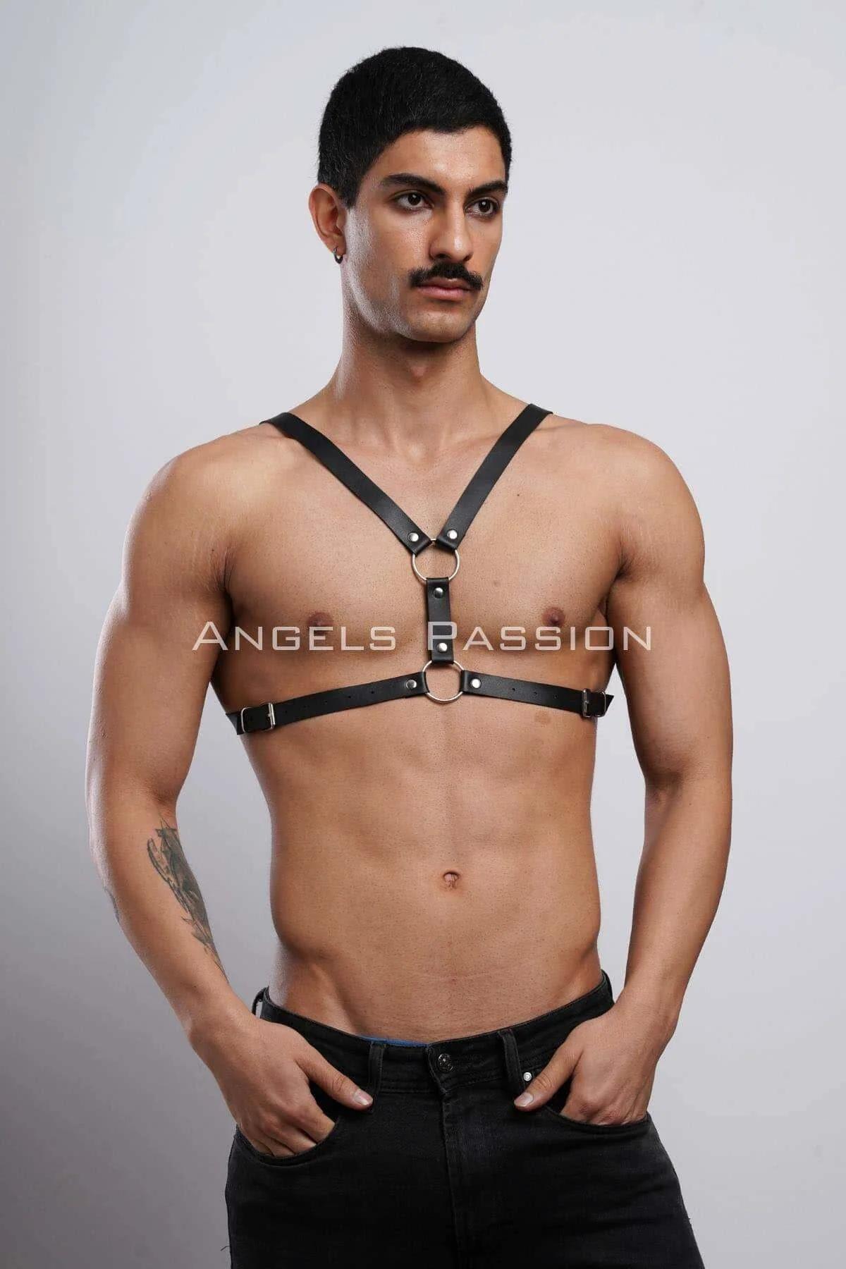 black faux leather Y-front chest harness with dual silver O-rings and adjustable buckles worn by male model